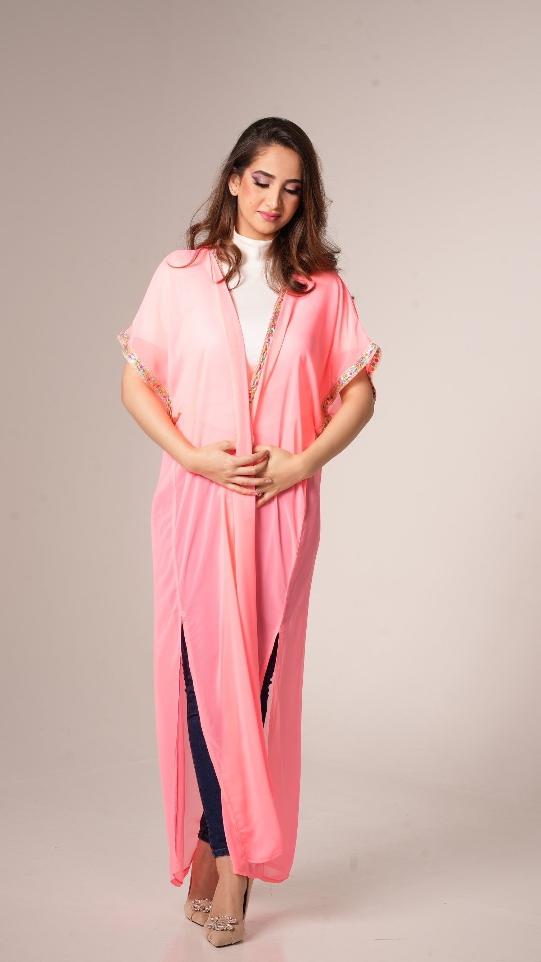 women wearing pink kaftan